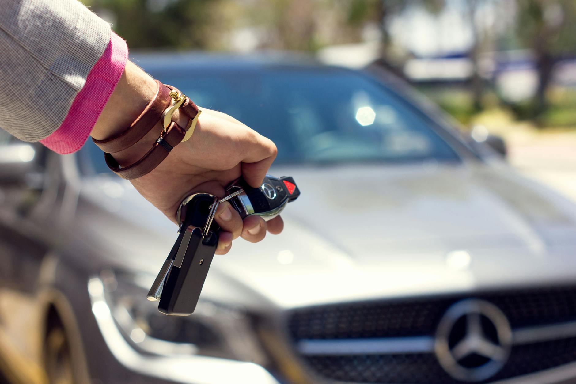 close up of woman closing the car from a distance